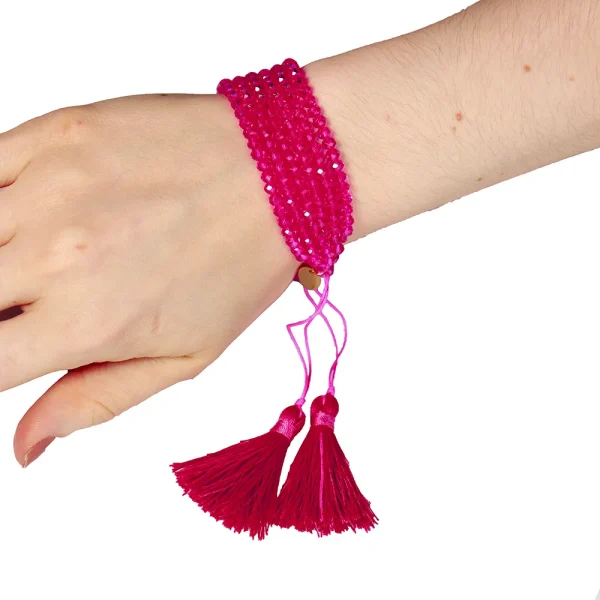 Pulsera con borlas fucsia